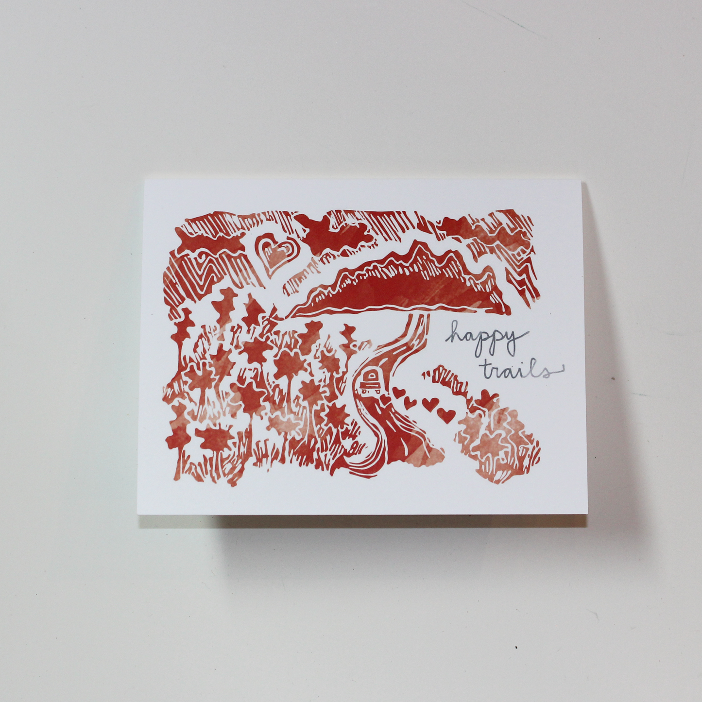 Bird and Buffalo greeting cards featuring romantic mountain scene design with "happy trails" text inspired by Jackson Hole, WY