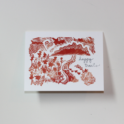 Bird and Buffalo greeting cards featuring romantic mountain scene design with "happy trails" text inspired by Jackson Hole, WY