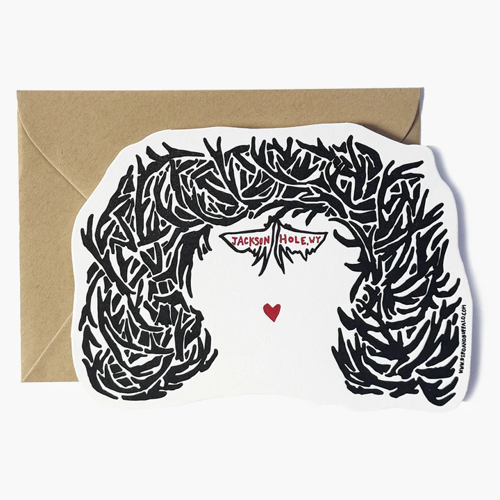 Bird and Buffalo letterpress greeting card with black antler arch pattern and red heart on a white background