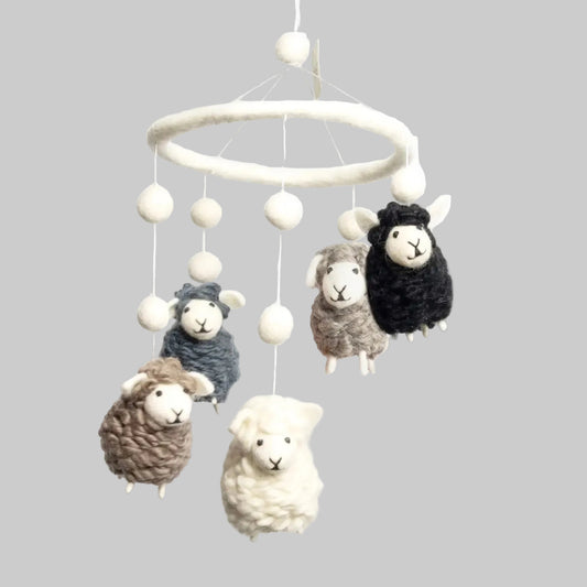 The Winding Road’s wool-felted baby mobile with black, white, and gray sheep, handmade and fair trade 