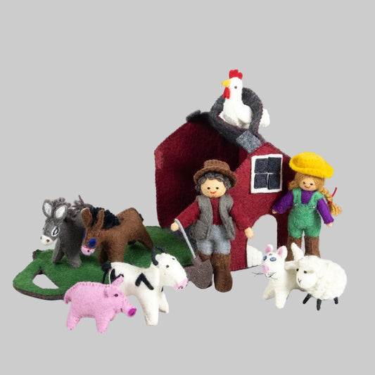The Winding Road's Red Barn Farmhouse with felted farmers and animals. Made of wool and is fair trade. 