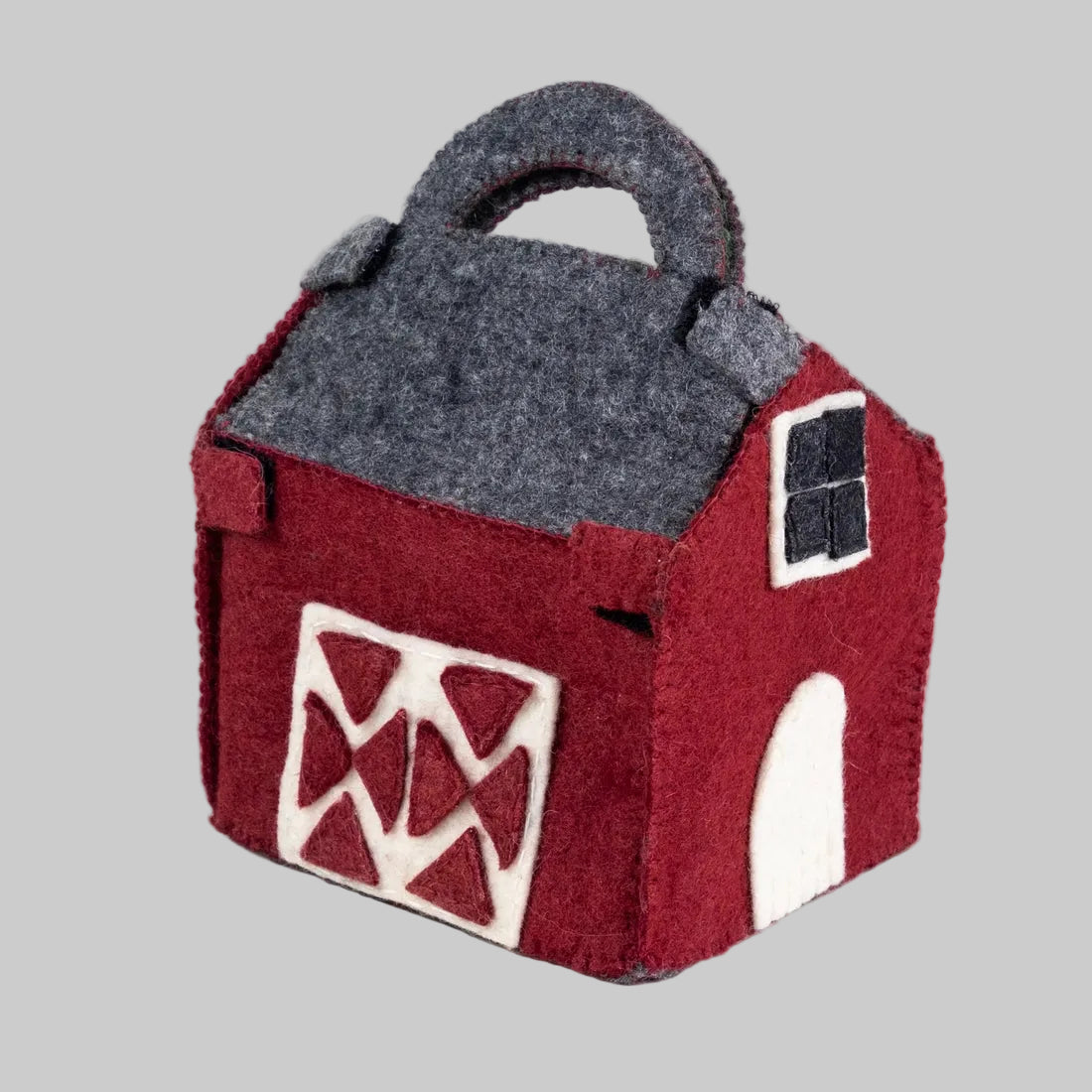 The Winding Road's Red Barn Farmhouse with felted farmers and animals. Made of wool and is fair trade. 