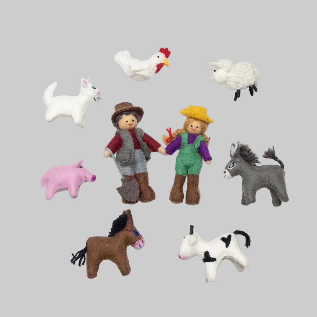The Winding Road's Red Barn Farmhouse with felted farmers and animals. Made of wool and is fair trade. 