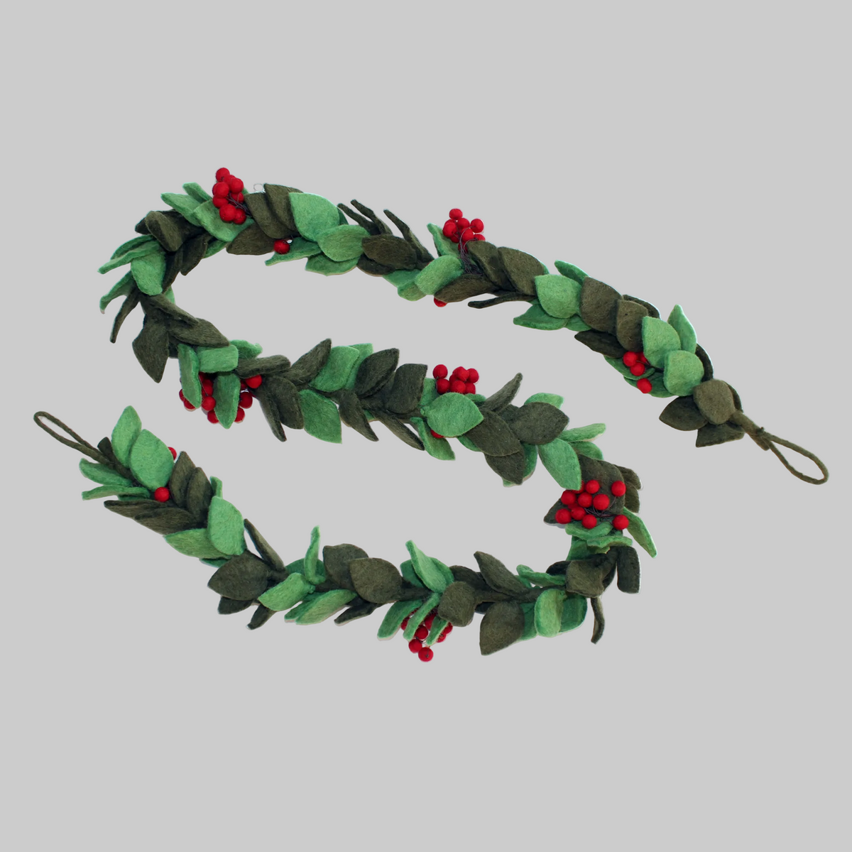 The Winding Road's wool-felted holiday garland featuring green sprigs of mistletoe. Handmade and fair trade.