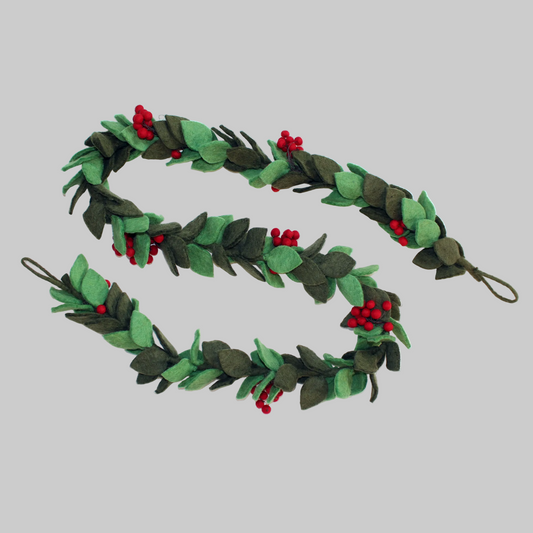 The Winding Road's wool-felted holiday garland featuring green sprigs of mistletoe. Handmade and fair trade.
