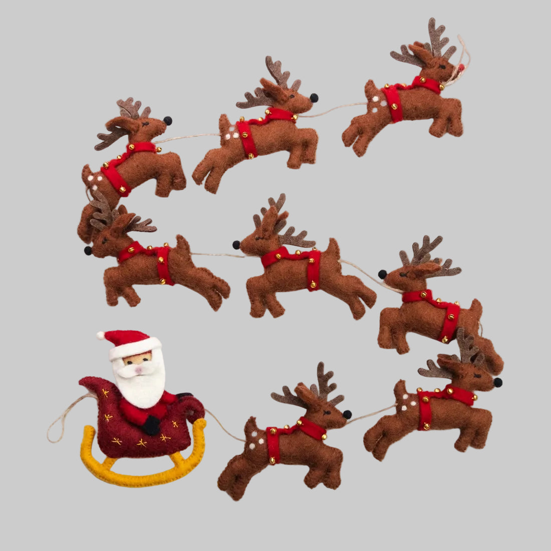 The Winding Road's wool-felted holiday garland featuring Santa and his sleigh with 8 reindeer. Handmade and fair trade.