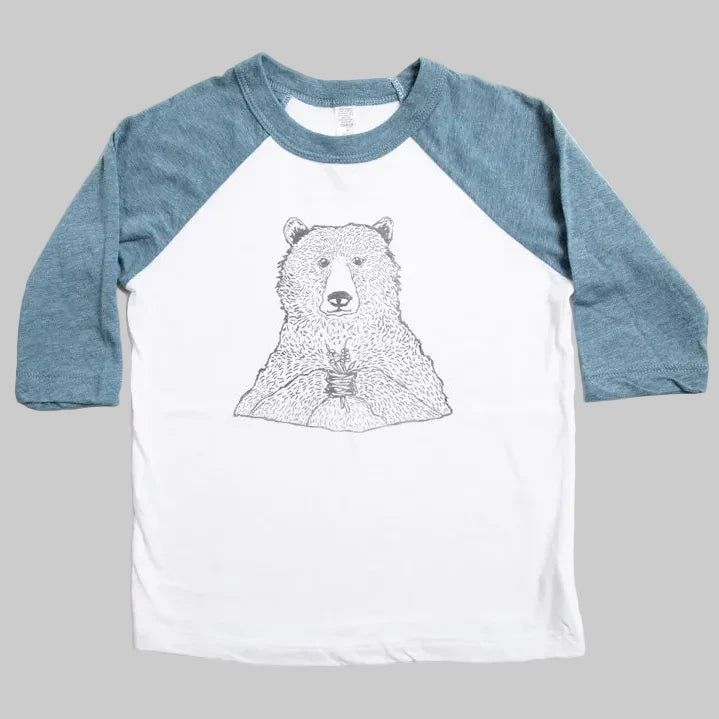 Bird and Buffalo’s kids baseball tee with blue sleeves and a bear holding flowers design, locally made in Jackson Hole, WY