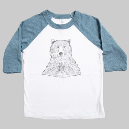 Bird and Buffalo’s kids baseball tee with blue sleeves and a bear holding flowers design, locally made in Jackson Hole, WY