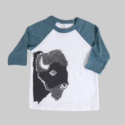 Bird and Buffalo’s kids baseball tee with blue sleeves and a bison design, locally made in Jackson Hole, WY