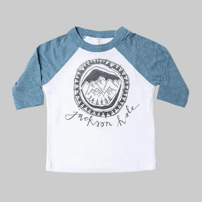 Bird and Buffalo’s kids baseball tee with blue sleeves and a mountain logo design, locally made in Jackson Hole, WY