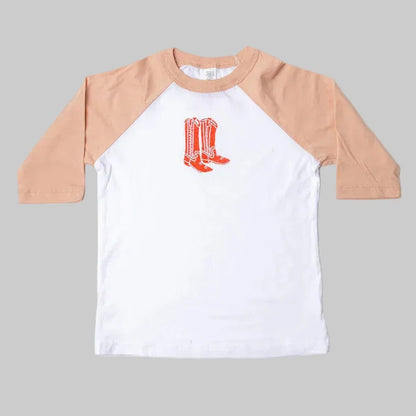 Bird and Buffalo’s kids baseball tee with pink sleeves and a red boots design, locally made in Jackson Hole, WY