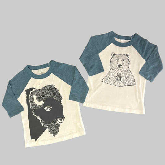 Bird and Buffalo’s kids baseball tee with blue sleeves and screen printed designs, locally made in Jackson Hole, WY