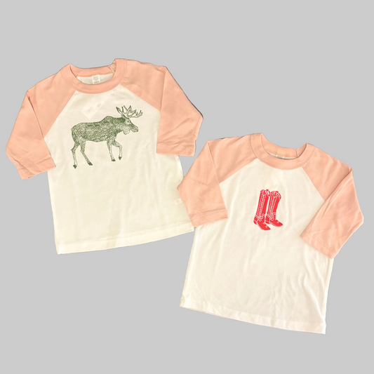 Bird and Buffalo’s kids baseball tees with pink sleeves and screen printed designs, locally made in Jackson Hole, WY