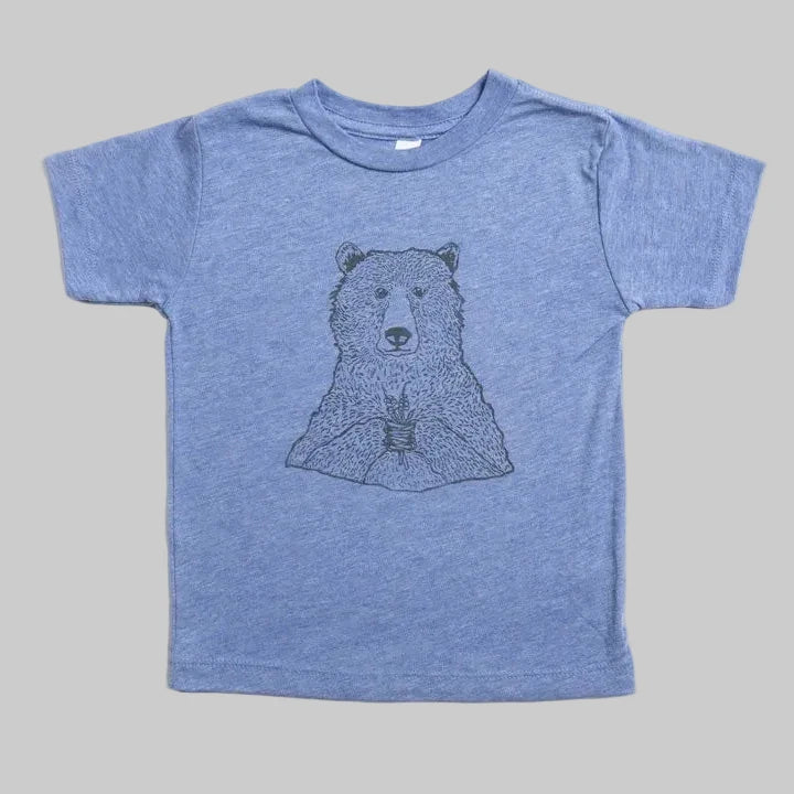 Bird and Buffalo’s kid’s t-shirt in blue with a bear holding flowers design, locally made in Jackson Hole, WY