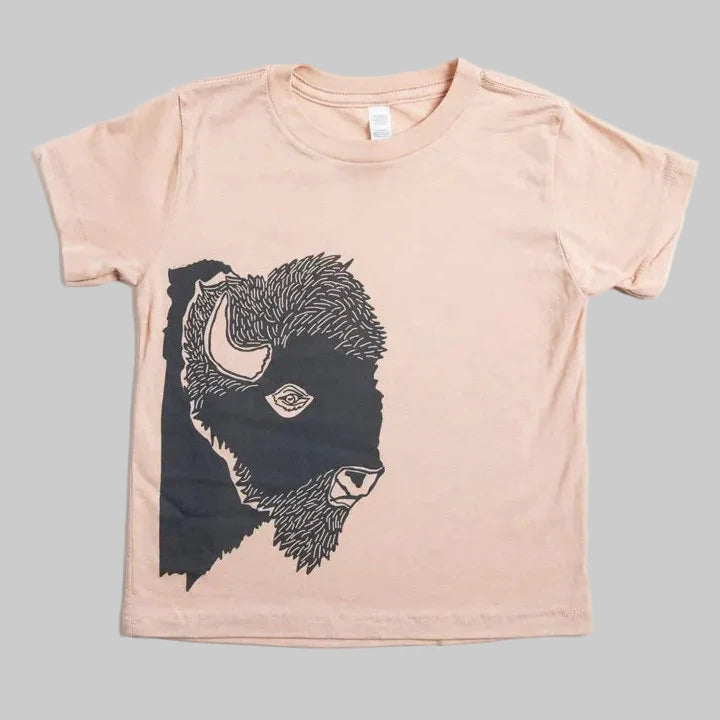 Bird and Buffalo’s kid’s t-shirt in pink with a bison profile design, locally made in Jackson Hole, WY