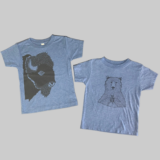 Bird and Buffalo’s kid’s t-shirt in blue with screen printed designs, locally made in Jackson Hole, WY