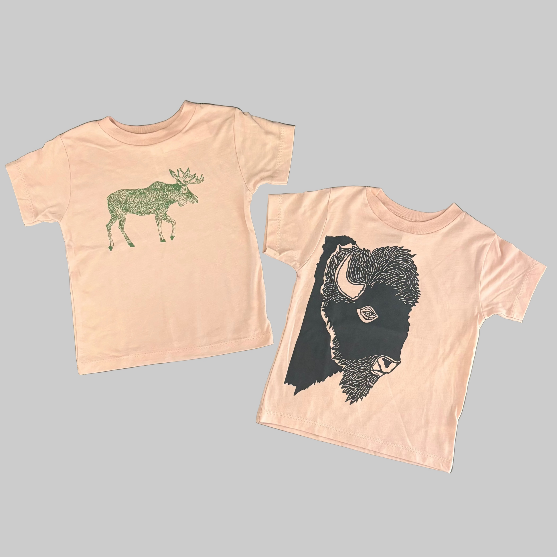 Bird and Buffalo’s kid’s t-shirt in pink with screen printed designs, locally made in Jackson Hole, WY