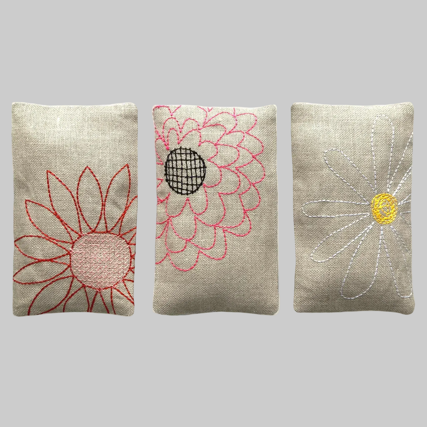 K. Studio’s lavender sachets embroidered with large floral designs in red, white, and pink