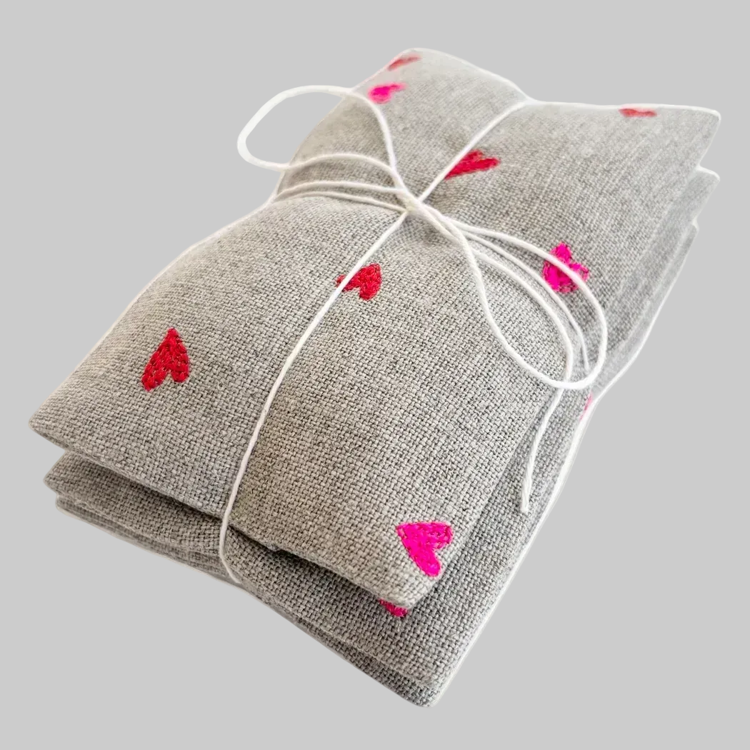 K. Studio’s lavender sachets embroidered with micro heart designs in bright pink and red