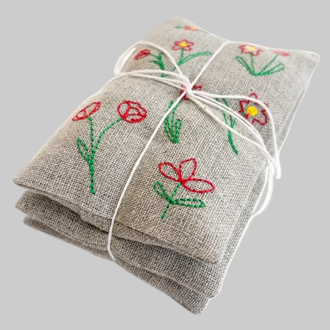 K. Studio’s lavender sachets embroidered with red tulip flower designs