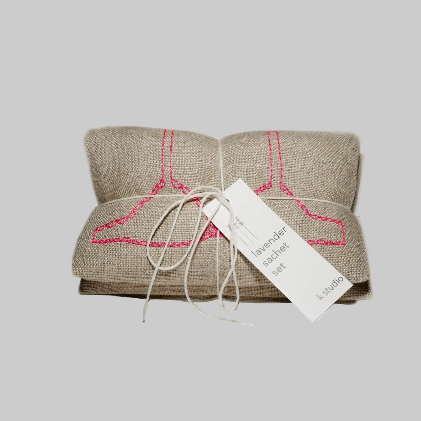 K. Studio’s lavender sachets embroidered with bright pink bra, underwear, and sock designs