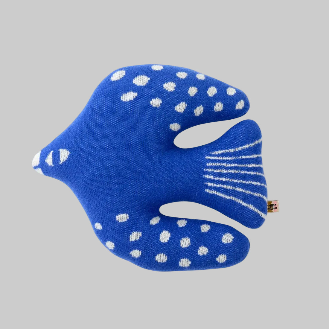 Donna Wilson's Bluebird throw pillow shaped like a flying bird