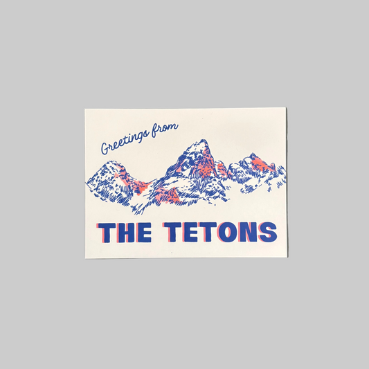 Little Scout Creative’s postcard featuring the Teton Mountains, designed by local artist Grace Peck