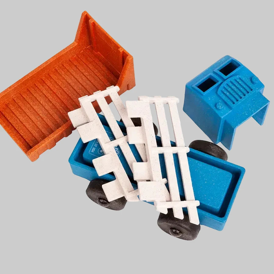 Puzzle stake truck made up of stackable and interchangeable parts made by Luke’s Toy Factory, recycled materials, made in the USA
