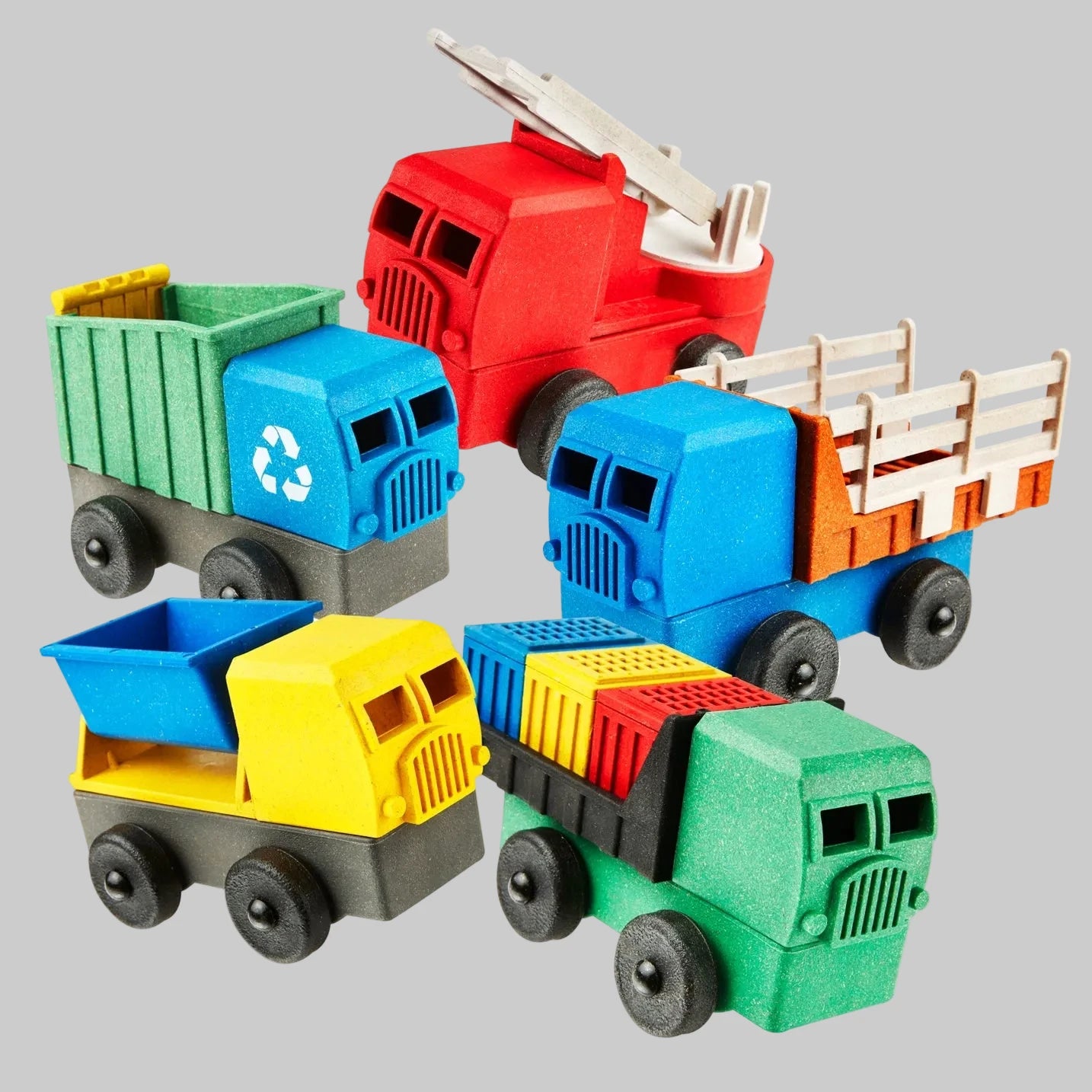 Puzzle trucks made up of stackable and interchangeable parts made by Luke’s Toy Factory, recycled materials, made in the USA