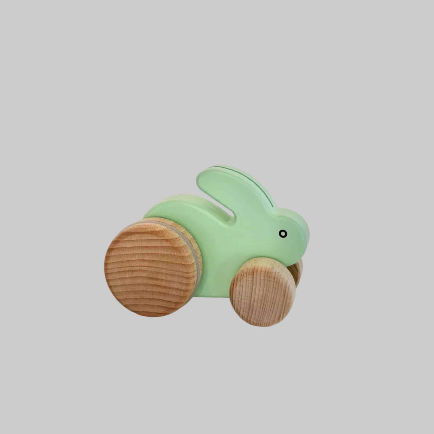 Little Poland Gallery’s wooden toys featuring a mint rabbit with bouncy wheels