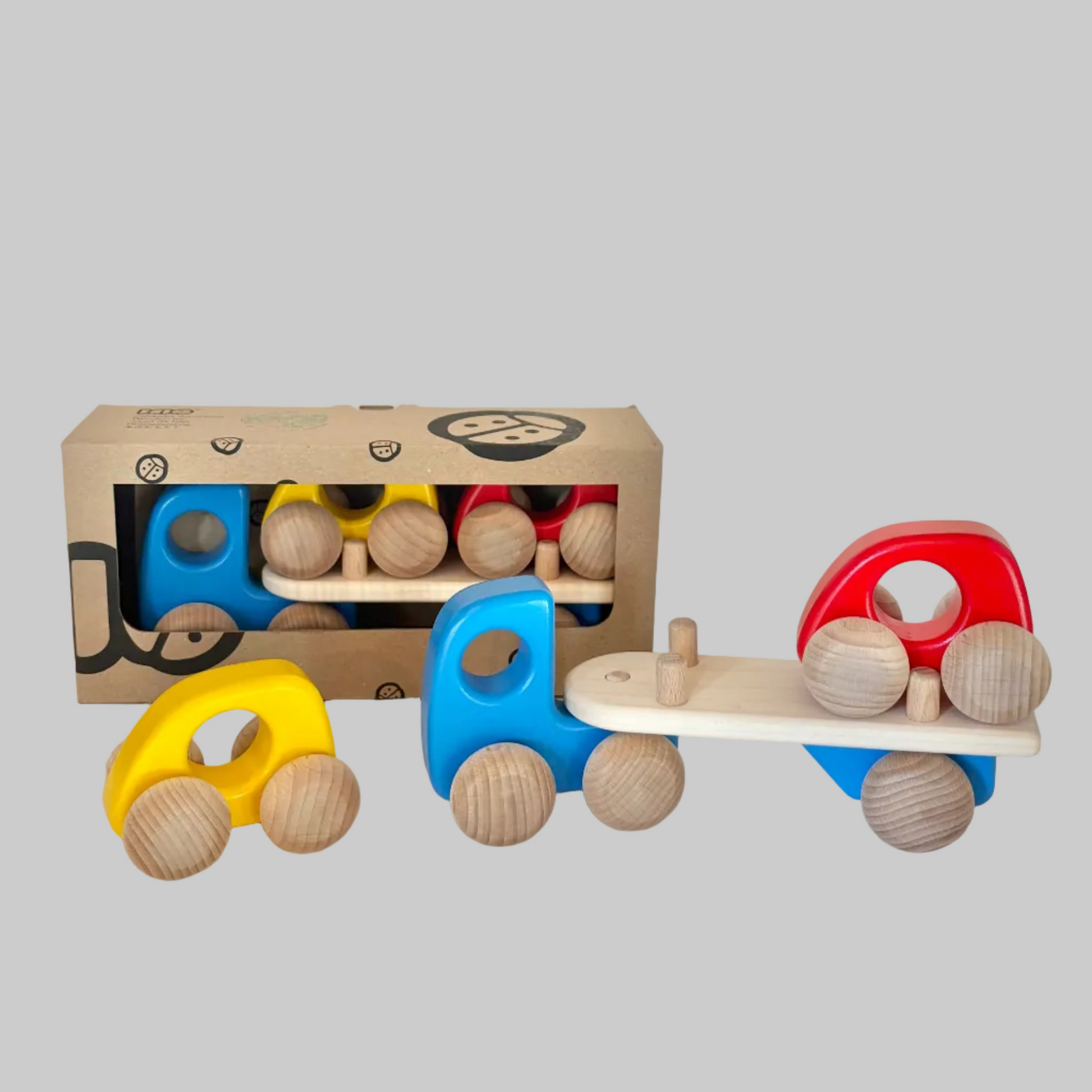 Little Poland Gallery’s wooden toys featuring an auto-transporter truck with removable cars